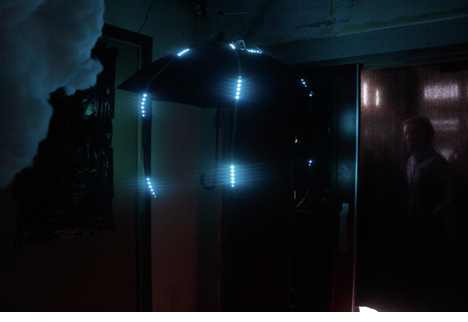 The umbrella lit with blue LEDs